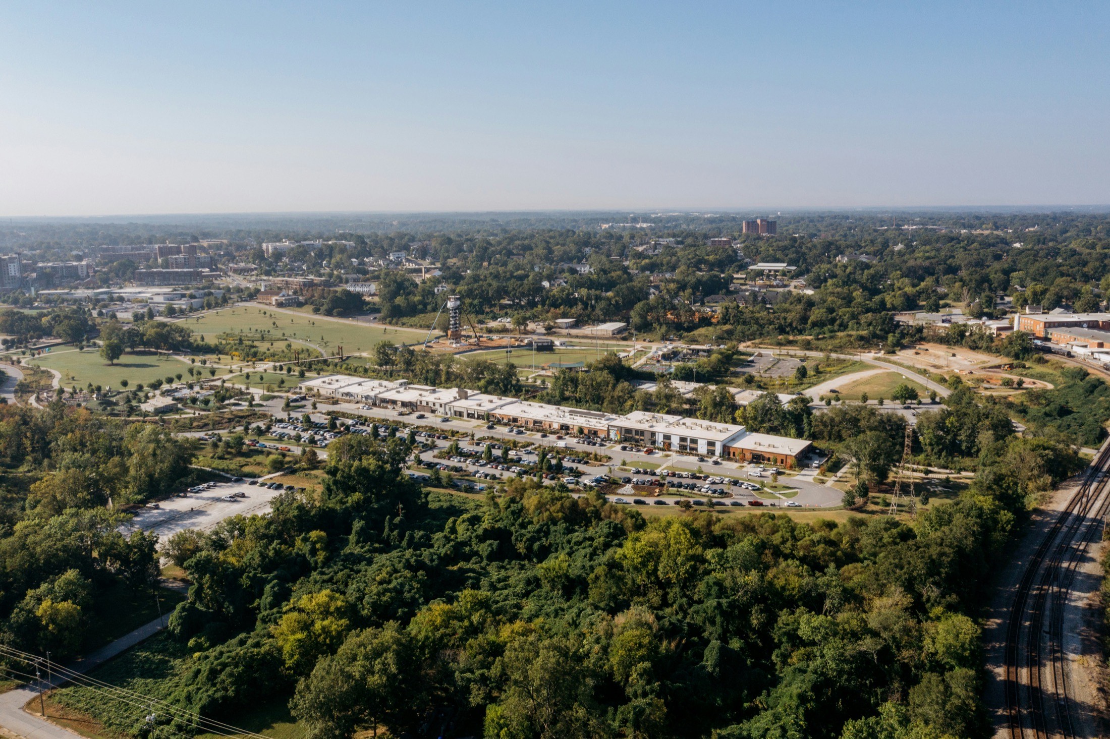 Aerial view of Northvale's town center, with a mix of tree-lined streets, a central green, and nearby commercial buildings.